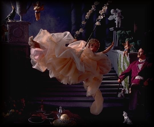 photo, Barbie on a swing (detail)  http://www.erols.com/browndk/bigswing.jpg