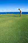 Man Golfing Near Sea