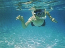 Young Snorkeler with Camera in
Caribbean Sea